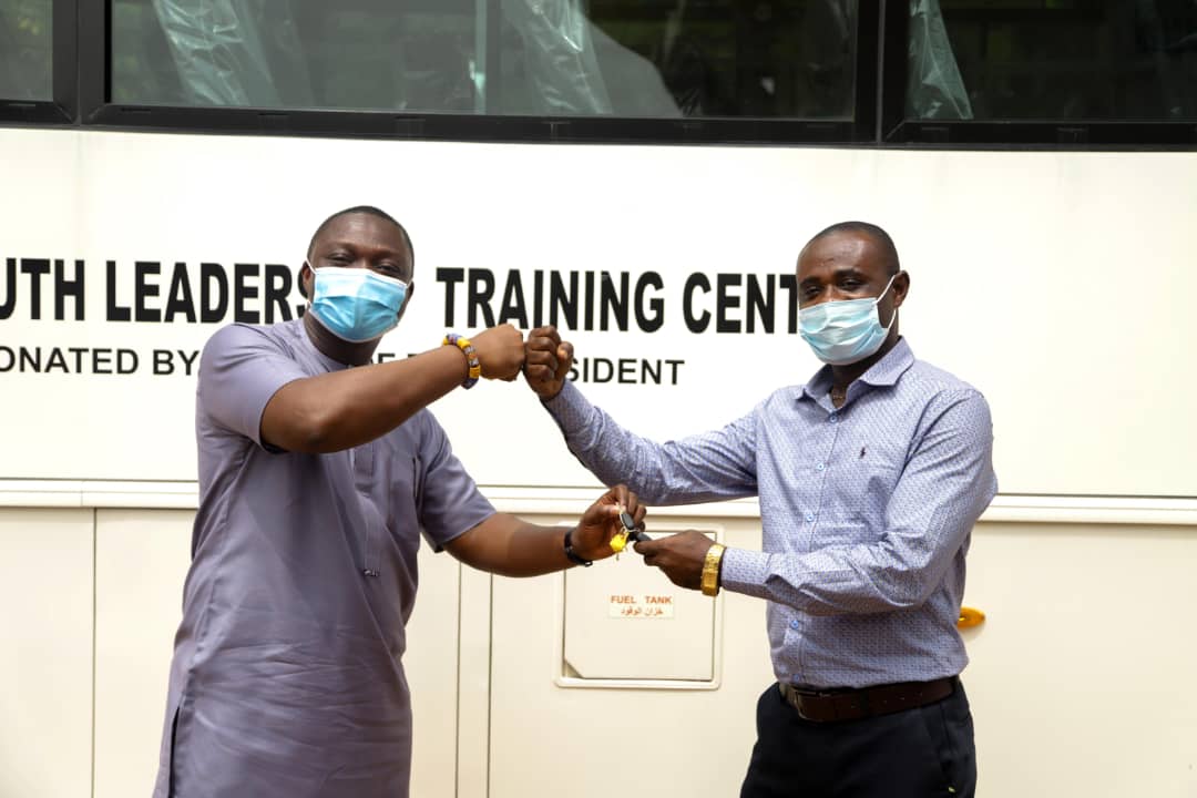 Acting CEO of NYA Mr. Nelson Owusu Ansah handing over A Bus to a Principal of the YLSTI